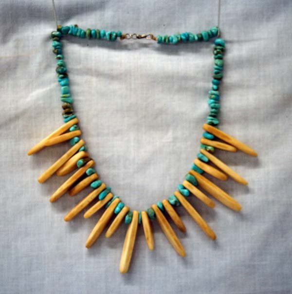 Navajo Bisbee Turquoise Bone & Bead Choker: Navajo Bisbee Turquoise Bone & Bead Choker. This piece has elongated bone beads, some as long as 1.5'', and smaller natural turquoise beads. Measures approx. 14'' end to end.