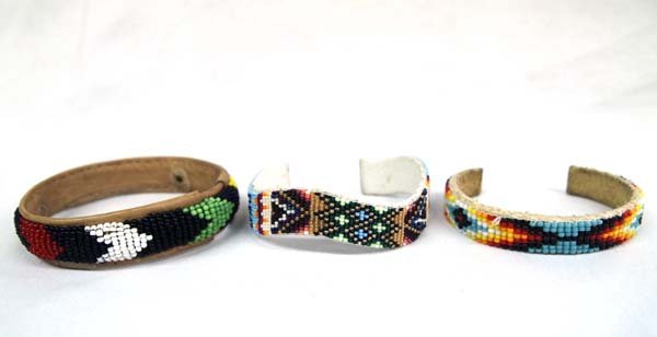 3 Native American Plains Indian Beaded Bracelets: 3 Native American Plains Indian Beaded Bracelets, includes 1 bangle and 2 cuff bracelets, largest measures 6.5'' which includes opening x .5''W, beautiful colors