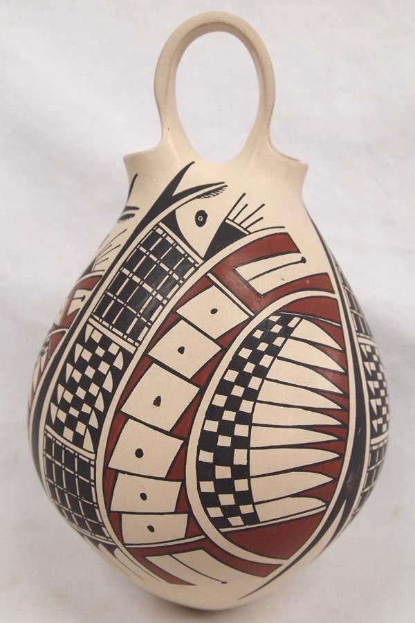 Mata Ortiz Polychrome Wedding Vase by Villa Lopez: Mata Ortiz Polychrome Wedding Vase by Jose Villa and Mary Lopez, Paquime' Inspired Designs, signed on bottom by artists, stylized bird and feather designs, measures 9.5''H x 6''D