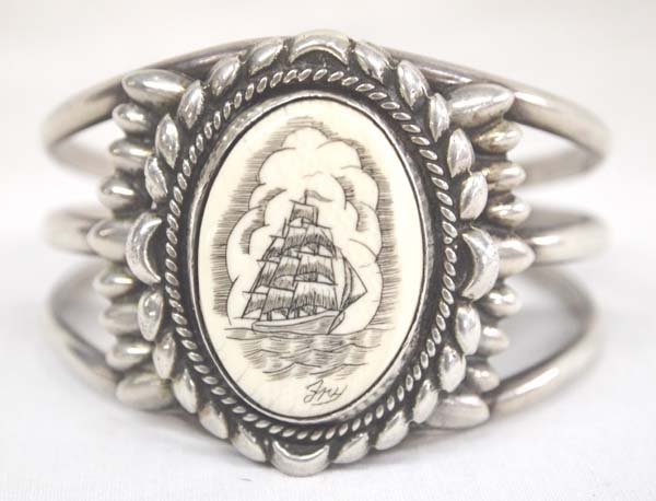Navajo Sterling Silver Scrimshaw Bracelet: Native American Navajo Sterling Silver Scrimshaw Bracelet, inside measures 6.5'' which includes opening x 2.5''W, scrimshaw is signed Fry, stamped sterling, 54.41g in total wt.