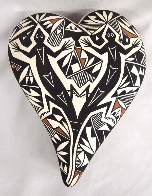 Acoma Lidded Heart Shaped Box by Sharon Lewis: Native American Acoma Lidded Heart Shaped Box by Sharon Lewis (Lucy Lewis' granddaughter), measures 7''L x 6''W x 2''H, beautiful lizard designs, signed on bottom by artist