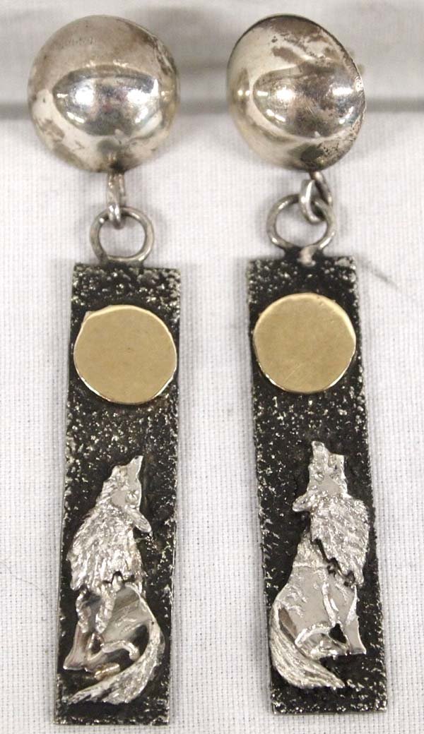 Lakota Sious 14kt Gold & Silver Earrings, M.L. Elk: Native American Lakota Sioux 14kt Gold on Sterling Earrings by Michael Little Elk (d. 2013), hallmarked ML Elk and stamped 14kt, measure 2.25''L x .5''W at widest point, 11.45g in total wt. Artist Bio