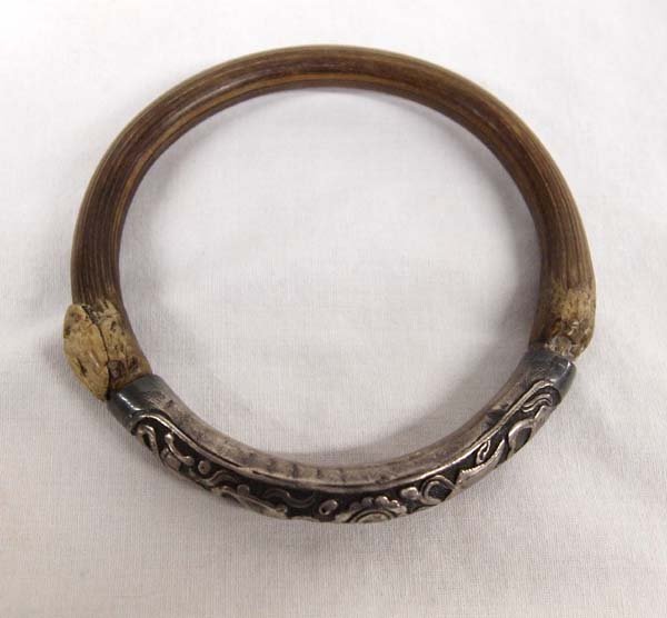 Vintage Ethnic Hill Tribe Silver Bangle Bracelet: Vintage Ethnic Hill Tribe Hand Hammered Repousse' Silver and Bamboo Bangle Bracelet, measures 3.25"D, flower and vine motif, both beautiful and unique