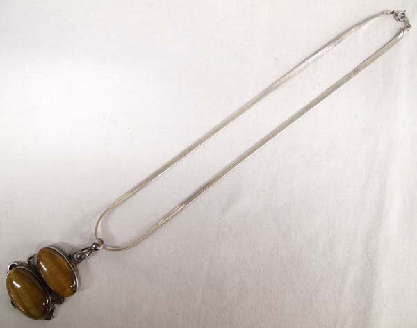 Large Sterling Silver Tiger's Eye Necklace: Large Sterling Silver Tiger's Eye Necklace, vintage double tiger's eye pendant hallmarked .925, cabochon measures 2.5'', sterling silver chain measures 18'' end to end