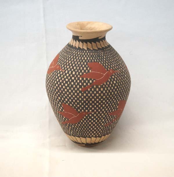 Mata Ortiz Eye Dazzler Hummingbird Jar by Ortiz: Mata Ortiz Eye Dazzler Hummingbird Jar by Marion Ortiz, measures 7.5''H x 5''D, signed on bottom by artist, stylized feather designs around base of jar
