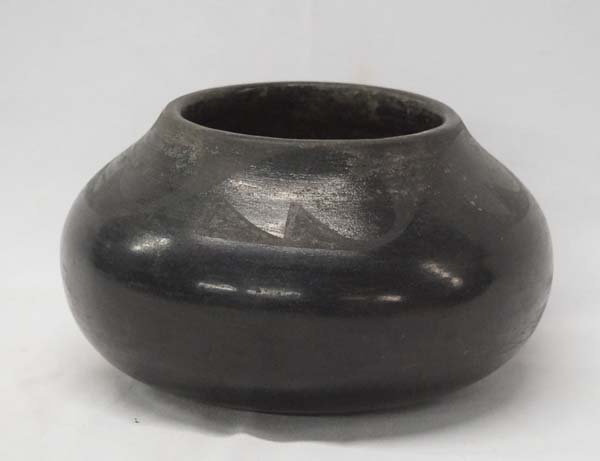 Vintage San Ildefonso Pottery Bowl by Desideria: Vintage Native American San Ildefonso Pottery Bowl by Desideria. This nice piece has no holes or cracks but has some slip wear on one side. Measures approx. 4.5'' x 7''.