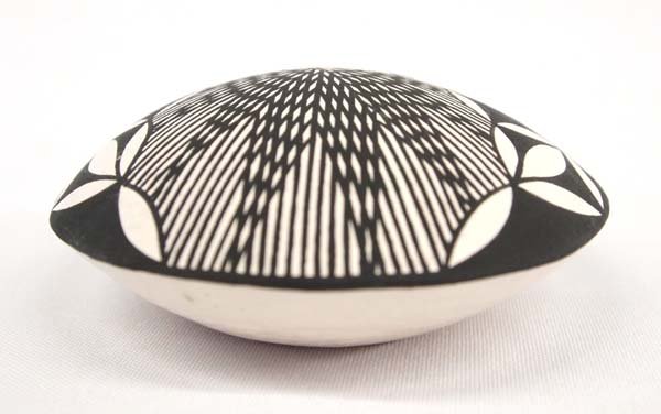 Native American Acoma Ant Seed Jar by V. Seymour: Native American Acoma Ant Seed Jar by V. Seymour, measures 4''D x 1.75''H, signed on bottom by artist, phenomenal little eye dazzler pottery jar