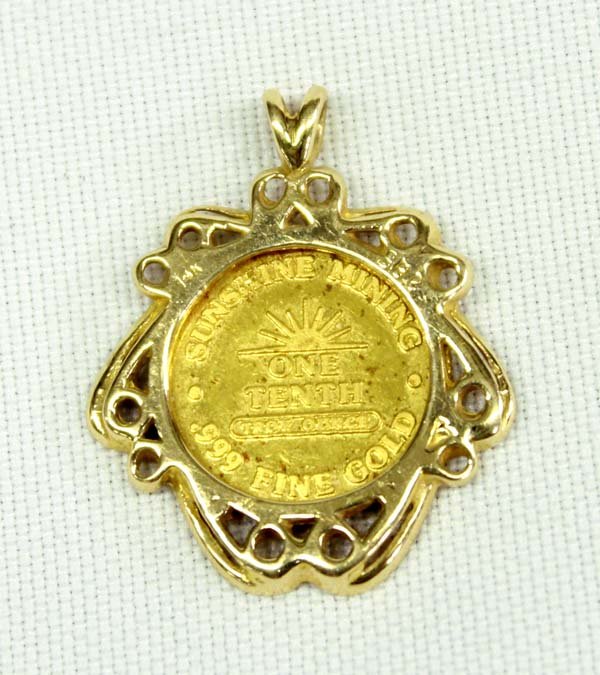.999 Fine Gold Coin Pendant: .999 Fine Gold Coin Pendant, measures 1''H x 7/8''D, coin is stamped 1987 Sunshine Golden Eagle on the front and Sunshine Mining .999 Fine Gold One Tenth Troy Ounce'', 5.83g in total wt.