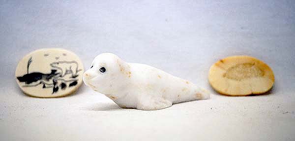 Alabaster Seal Carving and Scrimshaw Bone Amulet: Alabaster Seal Carving with Stand and Scrimshaw Bone Amulet, seal is the longest measuring 3''L x 1.25''H