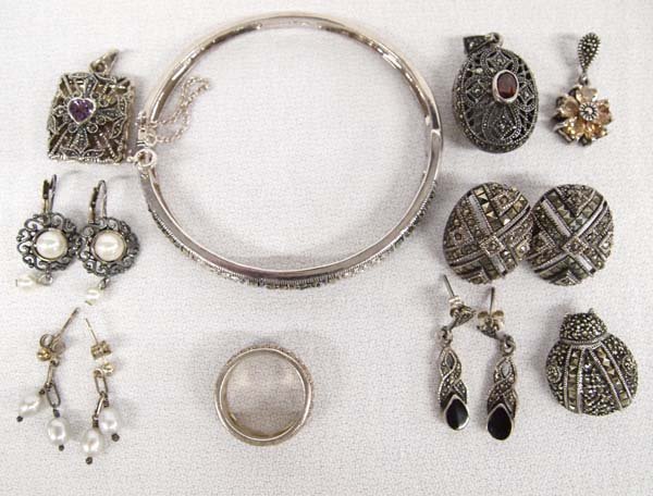 Collection of Sterling Silver Marcasite Jewelry: Collection of Sterling Silver Marcasite Jewelry, includes pin, earrings, pendants, bracelet, and ring, 66.6g in total wt.