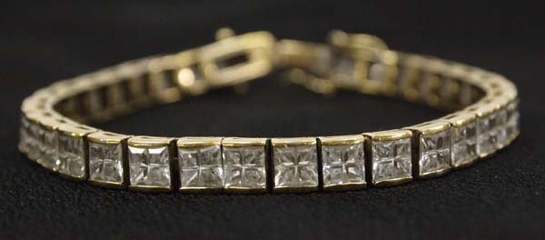 Estate Goldtone Over Sterling CZ Tennis Bracelet: From the Posey Estate, we have an Elegant Goldtone Over Sterling CZ Tennis Bracelet, measures 7.5'' end to end, stamped .925, 22.66g in total wt.