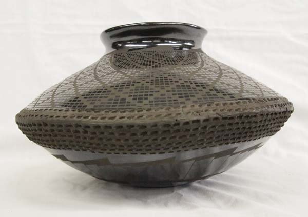 Mata Ortiz Eye Dazzler Pillow Pot by B. Soto: Mata Ortiz Eye Dazzler Pillow Pot by Benjamin Soto, measures 12'' x 6.5''H, signed by artist, gun metal finish