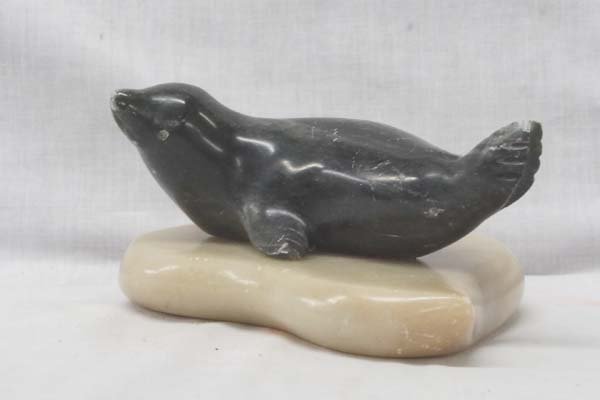 Northwest Coast Carved Soapstone Seal, Marble Base: Northwest Coast Carved Soapstone Seal on Marble Base by Bill Talmadge, measures 3'' x 5'' x 7.5'', Artist Info: ''Bill Talmadge was born in New Haven, Connecticut, and arrived in Alaska in 1974 after 