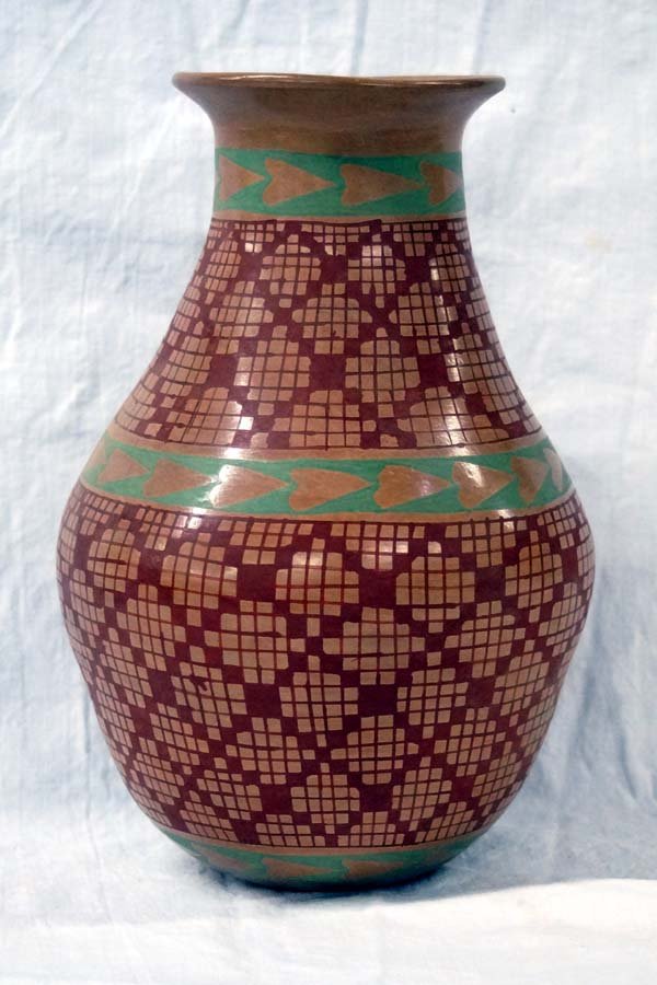 Mexican Mata Ortiz Polychrome Jar by Jacinto Gaona: Mexican Mata Ortiz Polychrome Jar by Jacinto Gaona, pulled spout, flared rim, eye dazzler designs, signed by artist and measures 9''H x 6''D