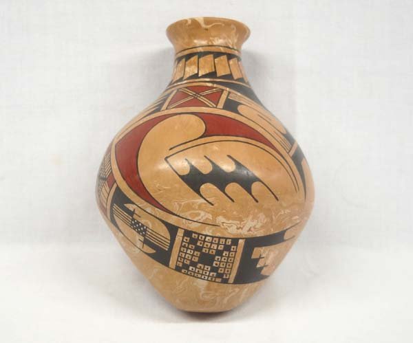 Mexican Mata Ortiz Polychrome Jar by R. Madrigal: Mexican Mata Ortiz Polychrome Jar by Rafaela Madrigal, measures 7'' x 8'', signed by artist, marbleized clay, features Paquime' inspired lines and designs