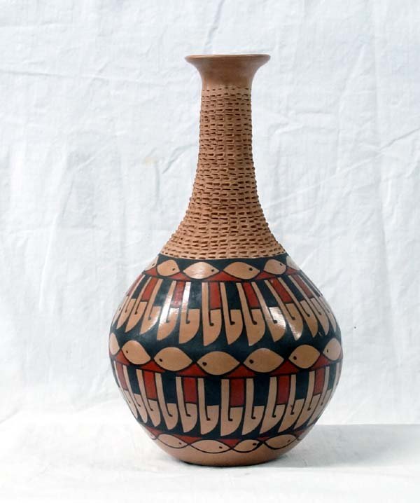 Mexican Mata Ortiz Polychrome Jar by Lucie Soto: Mexican Mata Ortiz Polychrome Jar by Lucie Soto, pulled spout, textured neck, features stylized feathers and fish designs, signed by artist and measures 10''H x 5.5''D