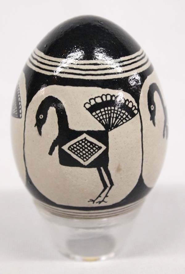 Traditional Ukrainian Pysanky Egg Art by P. Dix: Traditional Ukrainian Pysanky Egg Art by NM artist Patricia Dix. This hand painted chicken egg has a black on beige turkeys that mimic the designs of ancient Mimbres artisans. It is 2.5'' tall without