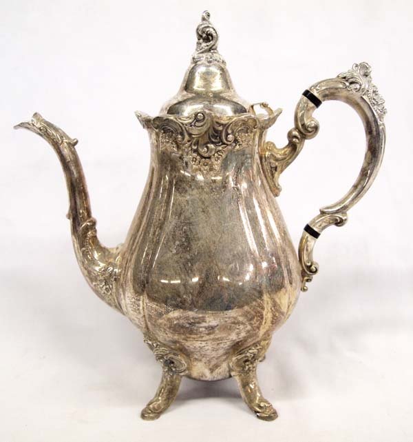 Antique Baroque Silver Plate Coffee Pot by Wallace: Lovely old four footed coffee pot in Wallace Silversmiths ''Baroque'' pattern. Hinged lid coffee pot is 5 1/2 inches diameter, 11 inches high, 11 inches handle to spout. Marked ''Baroque by Wallace 28