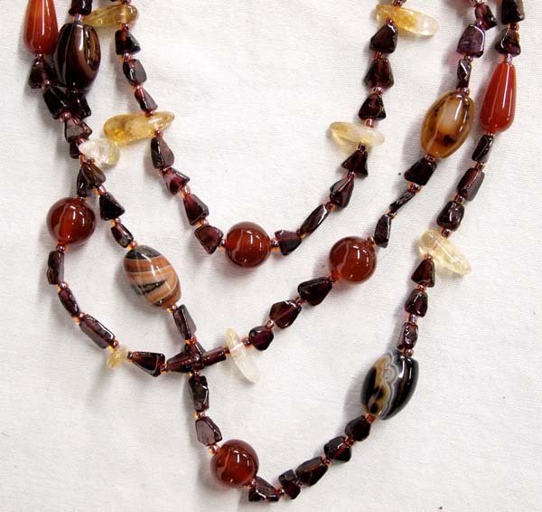 Carnelian, Garnet, and Agate 4 Strand Necklace: Carnelian, Garnet, and Agate 4 Strand Necklace, measures 42'' end to end, sterling cones, gorgeous colors