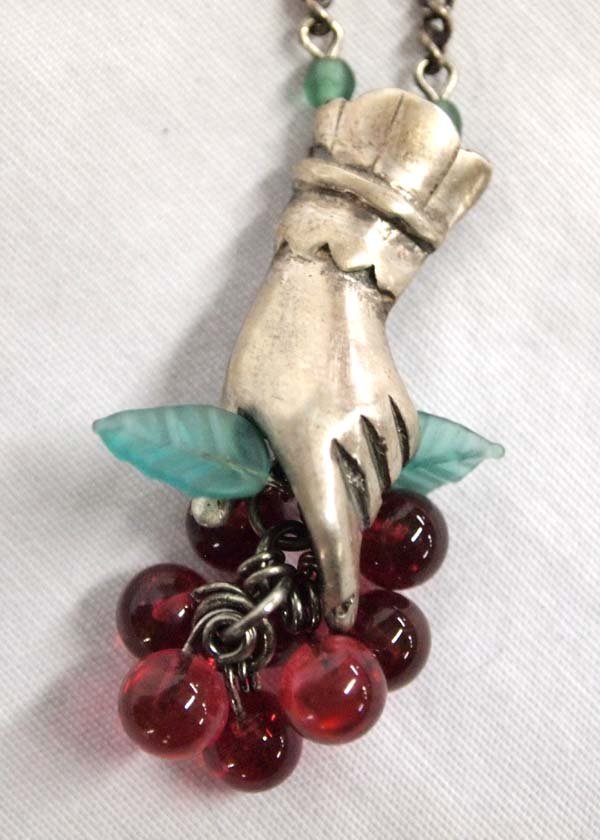 Lucy Isaacs Hand Holding Grapes Pendant Necklace: Lucy Isaacs Hand Holding Grapes Pendant Necklace, sterling chain measures 26'' and drop pendant measures 2'' x .5'', hallmarked, Lucy Isaacs Jewelry was based out of Manhattan, NY from 1968-2003
