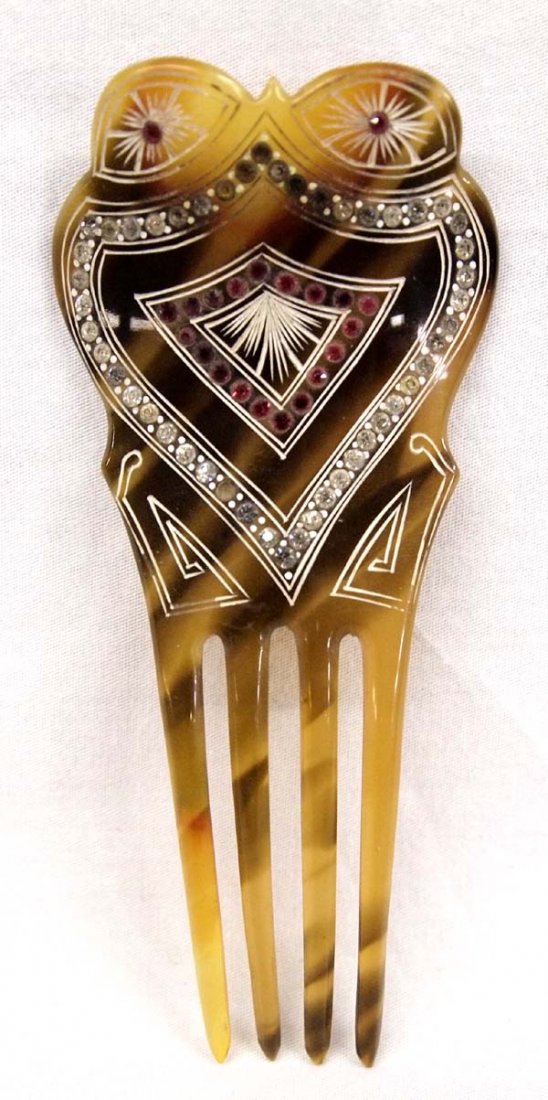 Antique Tortoise Shell Colored Celluloid Hair Comb: Antique Tortoise Shell Colored and Rhinestone Celluloid Hair Comb, spade shaped and etched designs, measures 2''W x 5''L, missing 1 rhinestone
