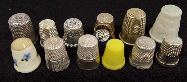 Collection of Antique Thimbles: Collection of Antique Thimbles, largest measures 7/8''L x .75''D, includes porcelain and sterling silver