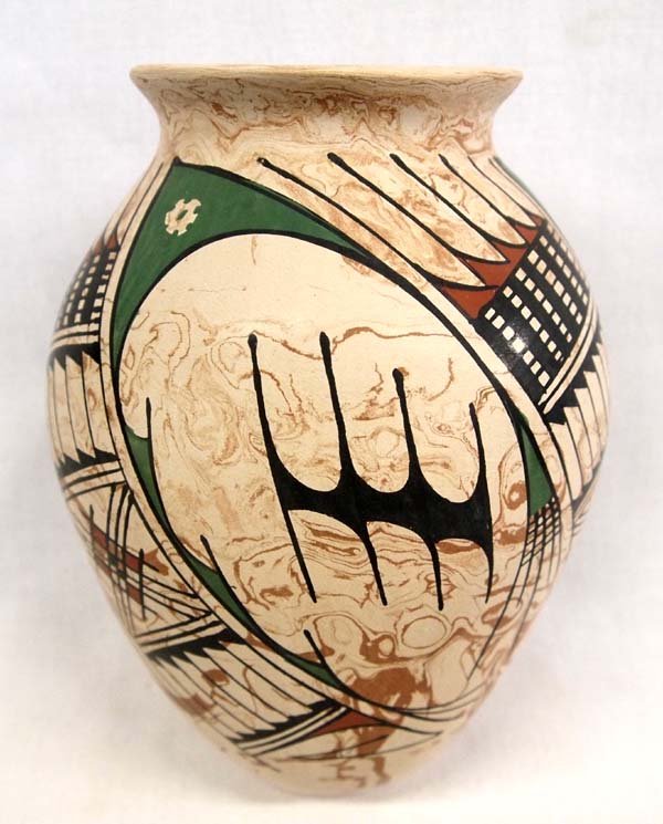 Mexican Mata Ortiz Polychrome Jar by Maria Villa: Mexican Mata Ortiz Polychrome Jar by Maria Villa, measures 7''H x 5''D, marbleized clay, signed by artist and features Paquime' inspired lines and designs
