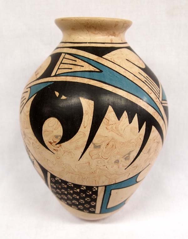 Mexican Mata Ortiz Polychrome Jar by Hector Villa: Mexican Mata Ortiz Polychrome Jar by Hector Villa, measures 7''H x 5''D and signed by artist, features Paquime' inspired lines and designs