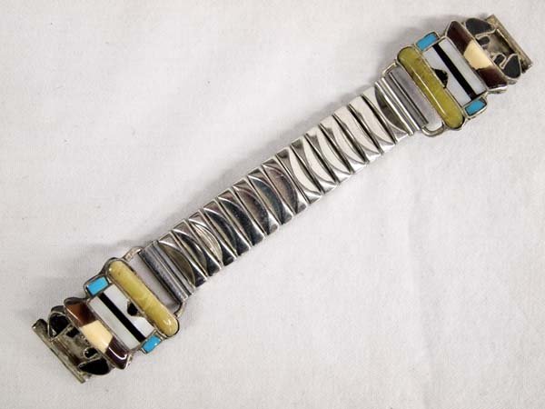1940 Zuni Stone to Stone Inlay Kachina Watch Band: 1940-1950 Native American Zuni Stone to Stone Inlay Kachina Face Watch Band, tips measure 1.25''L, inlay consists of turquoise, onyx, mother of pearl, and serpentine