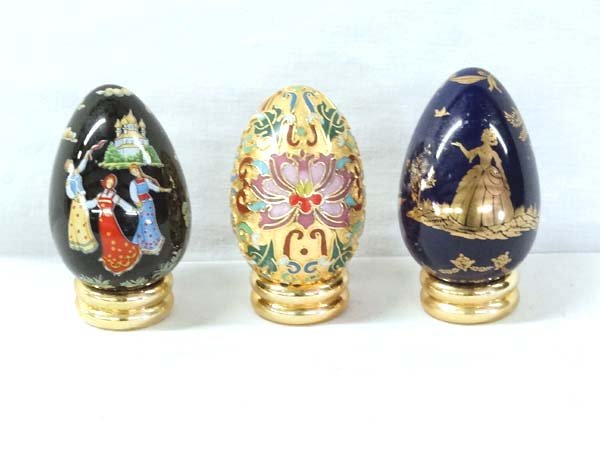 Collection of 3 Eggs on Stands: Collection of 3 Eggs on Stands, largest measures 3''H x 1.75''W