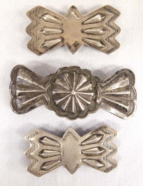 3 Native American Navajo Sterling Silver Pieces: 3 Native American Navajo Sterling Silver Pieces, longest measures 3''L x 1.5''W, 2 are pieces off of a concho belt and the other is a barrette by Fred Thompson and is hallmarked (clip on back needs to