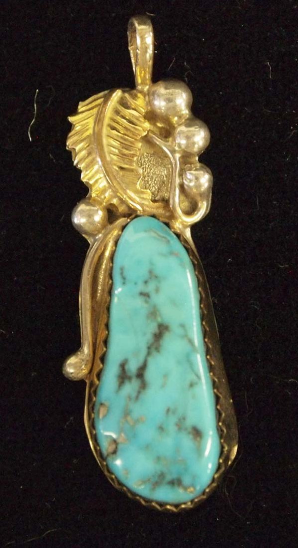 Navajo 12K Gold Filled on Silver Turquoise Pendant: Native American Navajo 12K Gold Filled on Silver Turquoise Pendant by Lucy C, measures 1.5''L x .5''W, gorgeous turquoise, hallmarked
