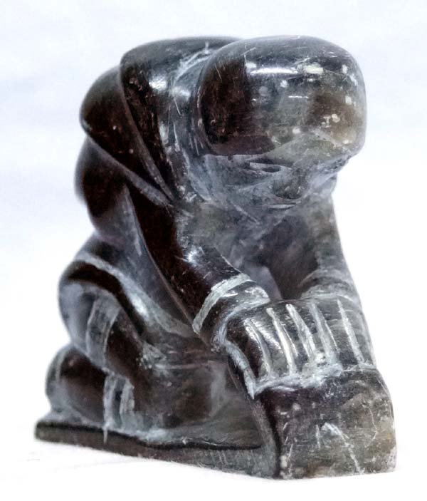 Alaskan Inuit Carved Stone Woman by Elijassiapik: Rare Native American Alaskan Inuit Carved Stone Woman (Cleaning skins) by Elijassiapik (1912-1972), measures 2'' x 2'' x 2.25'', signed in Inuktitut, FYI: ''Born in 1912, Elijassiapik, whose full name