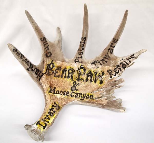 Moose Antler Sign for Bear Paw & Moose Canyon: Vintage Moose Antler Sign for Bear Paw & Moose Canyon Store, advertises their services and wares such as livery, hardware, guns, pistols, tinware, and repairs, measures 19''H x 19''W