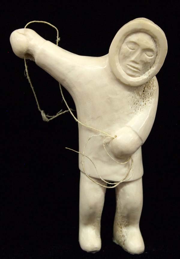 Canadian Inuit Carved Bone Fisherman: Native American Canadian Inuit Carved Bone Fisherman, measures 4'' x 5.5'' x 1.25''Deep