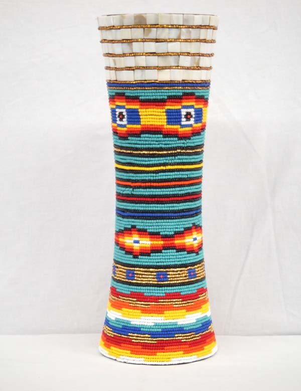 Large Kills Thunder Beaded Wooden Vase.: Large Kills Thunder Beaded Wooden Vase. This piece measures 17''H x 6''W. Kathleen Kills Thunder was born in Seattle, Washington. Kathy has been painting and beading since she was six. She uses bright