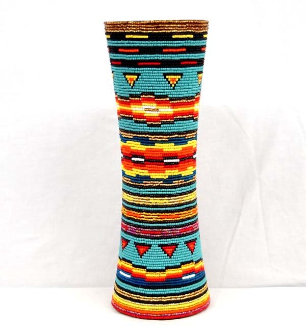 Large Kills Thunder Beaded Wooden Vase.: Large Kills Thunder Beaded Wooden Vase. This piece measures 17''H x 6''W. Kathleen Kills Thunder was born in Seattle, Washington. Kathy has been painting and beading since she was six. She uses bright