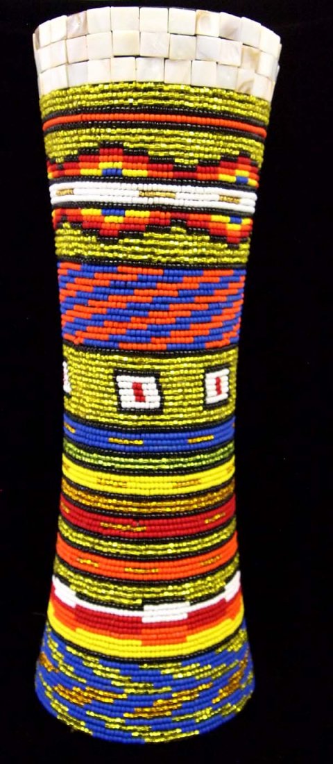 Large Beaded Vase by Kills Thunder: Large Beaded Vase by Kills Thunder. measures 17''H x 6''W. Kathleen Kills Thunder was born in Seattle, Washington. Kathy has been painting and beading since she was six. She uses bright color palette 