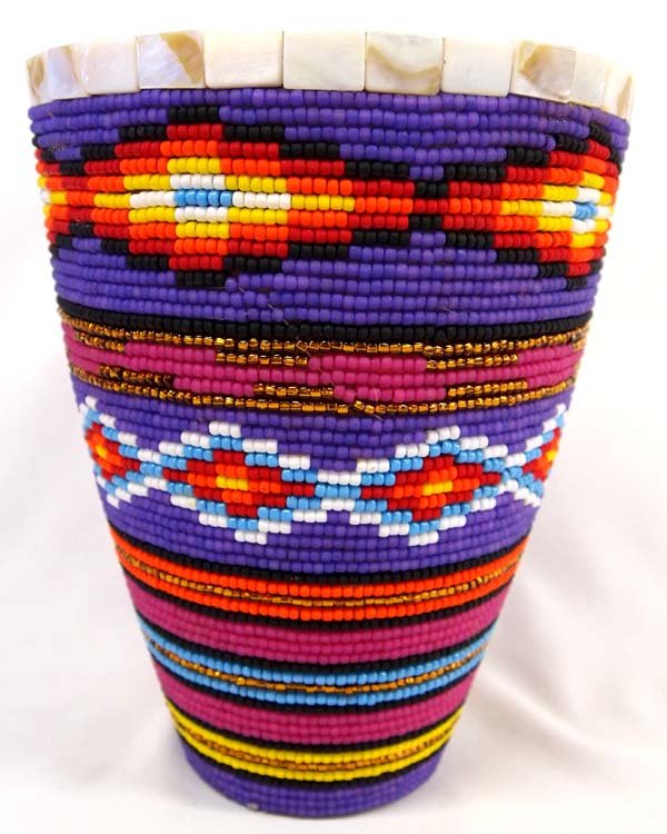 Hand Beaded Metal Vase by Kills Thunder.: Hand Beaded Metal Vase by Kills Thunder. With vivid colors this piece measures 9.5''H x 7.5''D. Kathleen Kills Thunder was born in Seattle, Washington. Kathy has been painting and beading since she wa