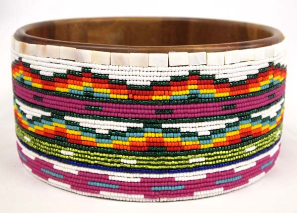Hand Beaded Wooden Bowl by Kills Thunder.: Hand Beaded Wooden Bowl by Kills Thunder. This splendid item measures 5'' x 11''. Kathleen Kills Thunder was born in Seattle, Washington. Kathy has been painting and beading since she was six. She use