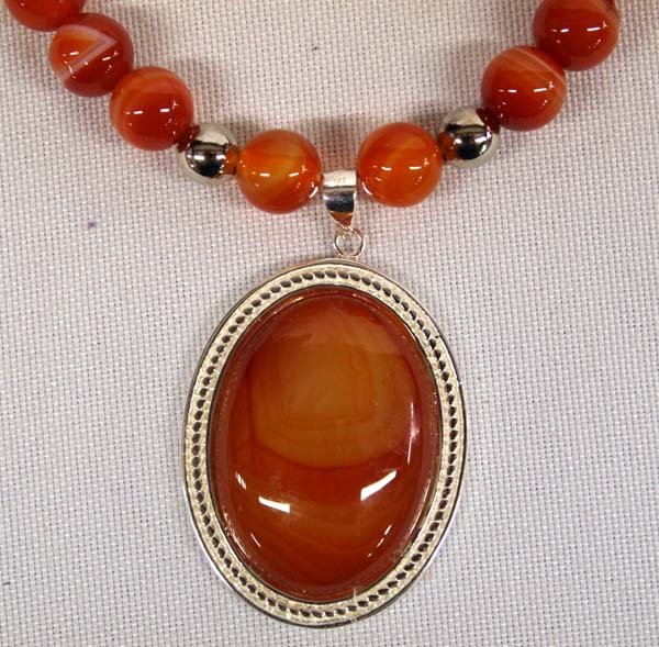 Striped Orange Carnelian Pendant Necklace: Gorgeous Striped Orange Carnelian Pendant Necklace, silver setting, beads, and clasp, measures 20'' end to end, pendant measures 1.5'' x 1''