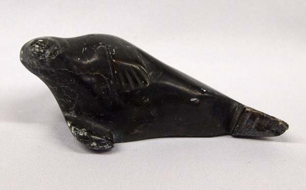 Canadian Inuit Carved Stone Seal, Lydia Kasudluak: Native American Canadian Inuit Carved Stone Seal by Lydia Kasudluak (b. 1942), signed in Inuktitut, measures 3'' x 6''