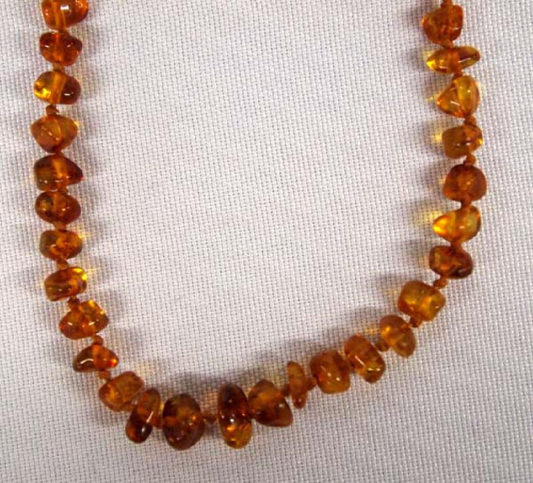 Cici's Genuine Baltic Amber Nugget Choker: Cici's Genuine Baltic Amber Nugget Necklace, measures 14'' end to end, comes in original box with provenance