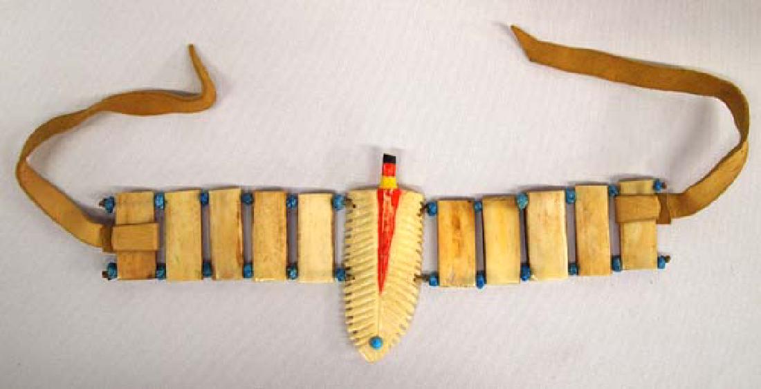 Unusual Carved Bone Bracelet: Unusual Carved Bone Bracelet, embellished with turquoise nuggets and leather ties, measures 9.5''L x 3.5''W