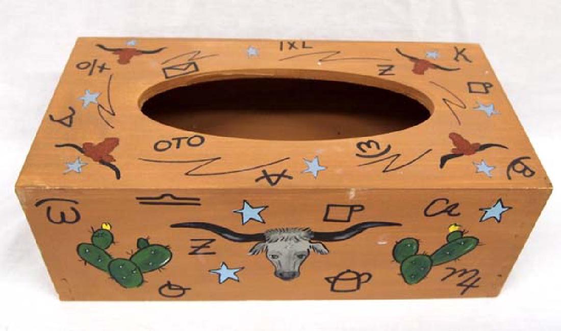 Western Americana Wooden Cowboy Tissue Box Cover: Western Americana Wooden Cowboy Tissue Box Cover, measures 4'' x 11'' x 5.5'', signed by artist