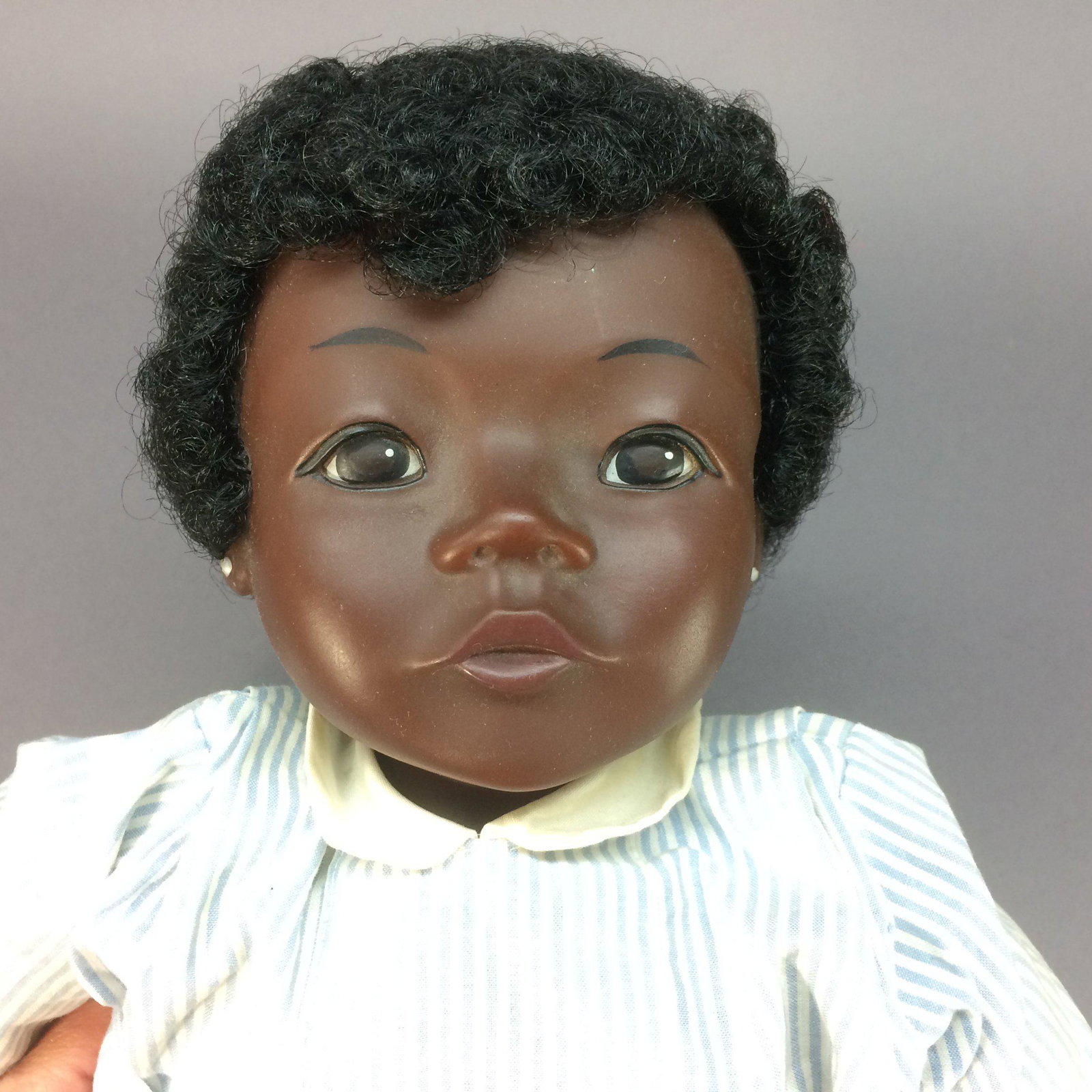 Marie Luic Black Doll by GTC – Made in Germany: Wonderful character doll sold by GTC (German Toys & Crafts), likely in the 1970s. She is about 19” tall (48.3 cm) and has a vinyl head with rooted black hair, and soft stuffed cloth body. She is mar