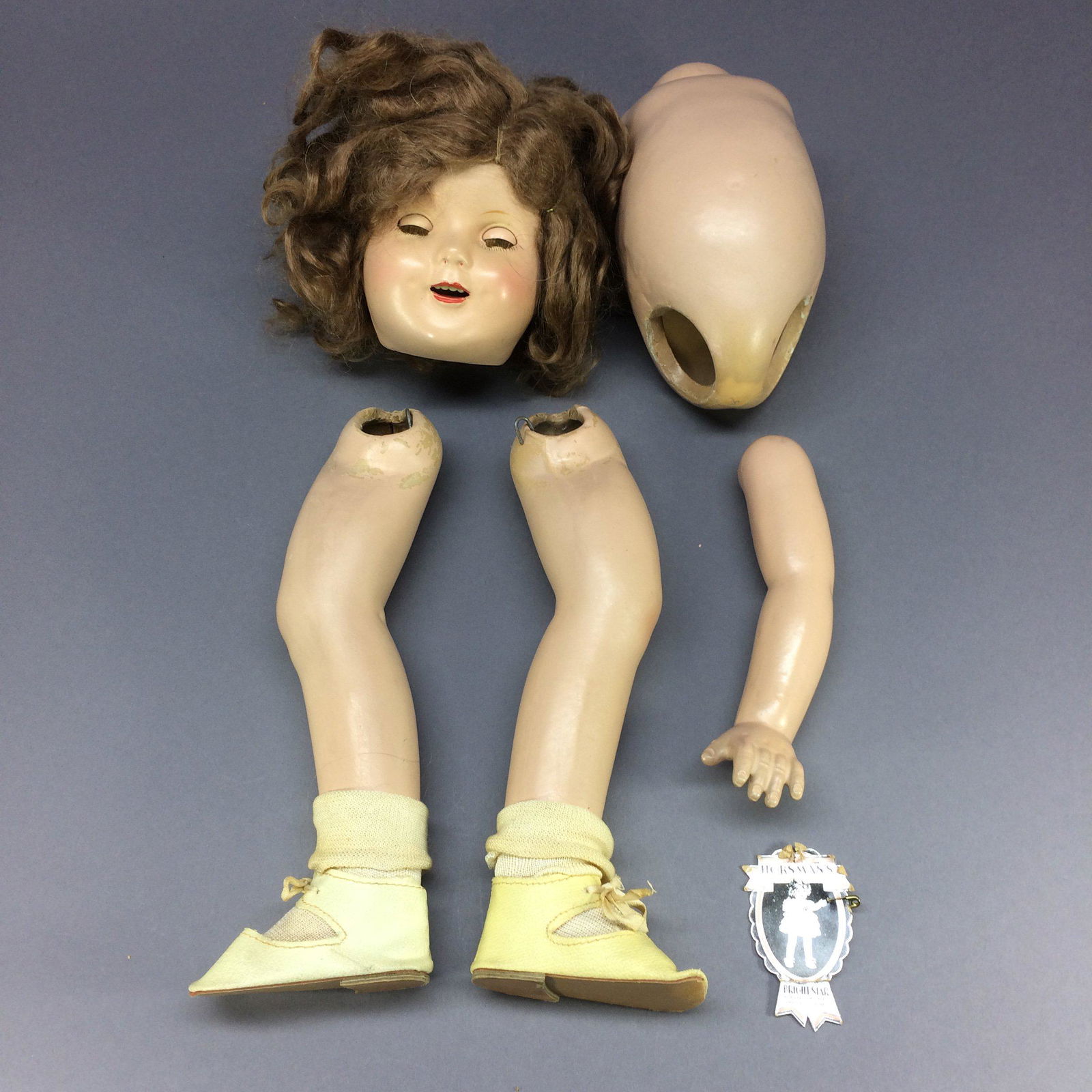 Composition Shirley Temple Type Doll Parts: This composition doll may be an unmarked Ideal Shirley Temple doll, or a close copy. Her mohair wig, which appears to be original, is auburn, not dark blonde like a typical Shirley’s. (The pictures