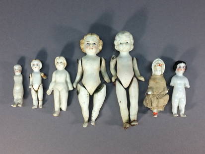 Antique Stone Bisque & Frozen Charlotte Doll Lot: This lot includes seven dolls ranging in size from 2” to 4 ¼” (5 to 10.8 cm). One is marked Made in Japan, but the rest were likely made in Germany. The largest doll has blue eyes glazed to look