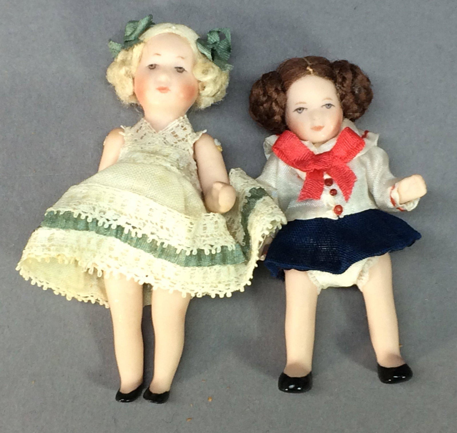 Cathy Hansen Miniature Porcelain Dolls 1982: This pair of wonderful miniature porcelain dolls by Cathy Hansen resemble the German character dolls made by Kammer and Rheinhardt and Kathe Kruse in the early 20th century. The larger doll is 3" tall