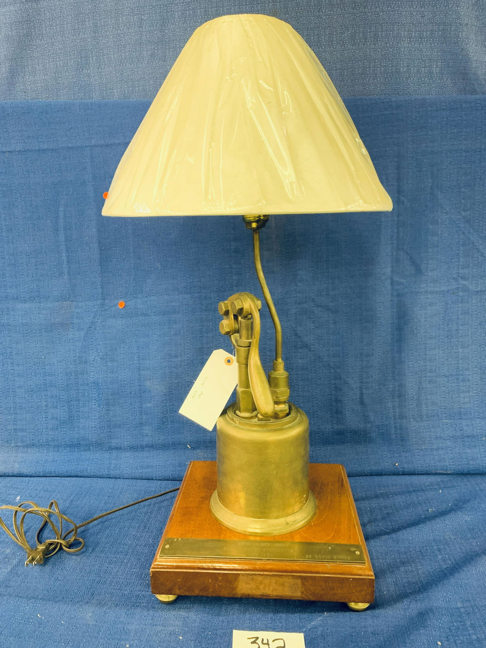 Brass Lubricator Lamp: Brass Lubricator Lamp, mounted on wood, Made on October 1986, Henry Steinbrunner for Judy by David Miller